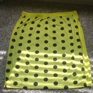 Neon yellow polka dot skirt.